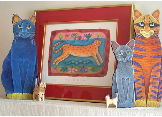 Cat art on mantle with print